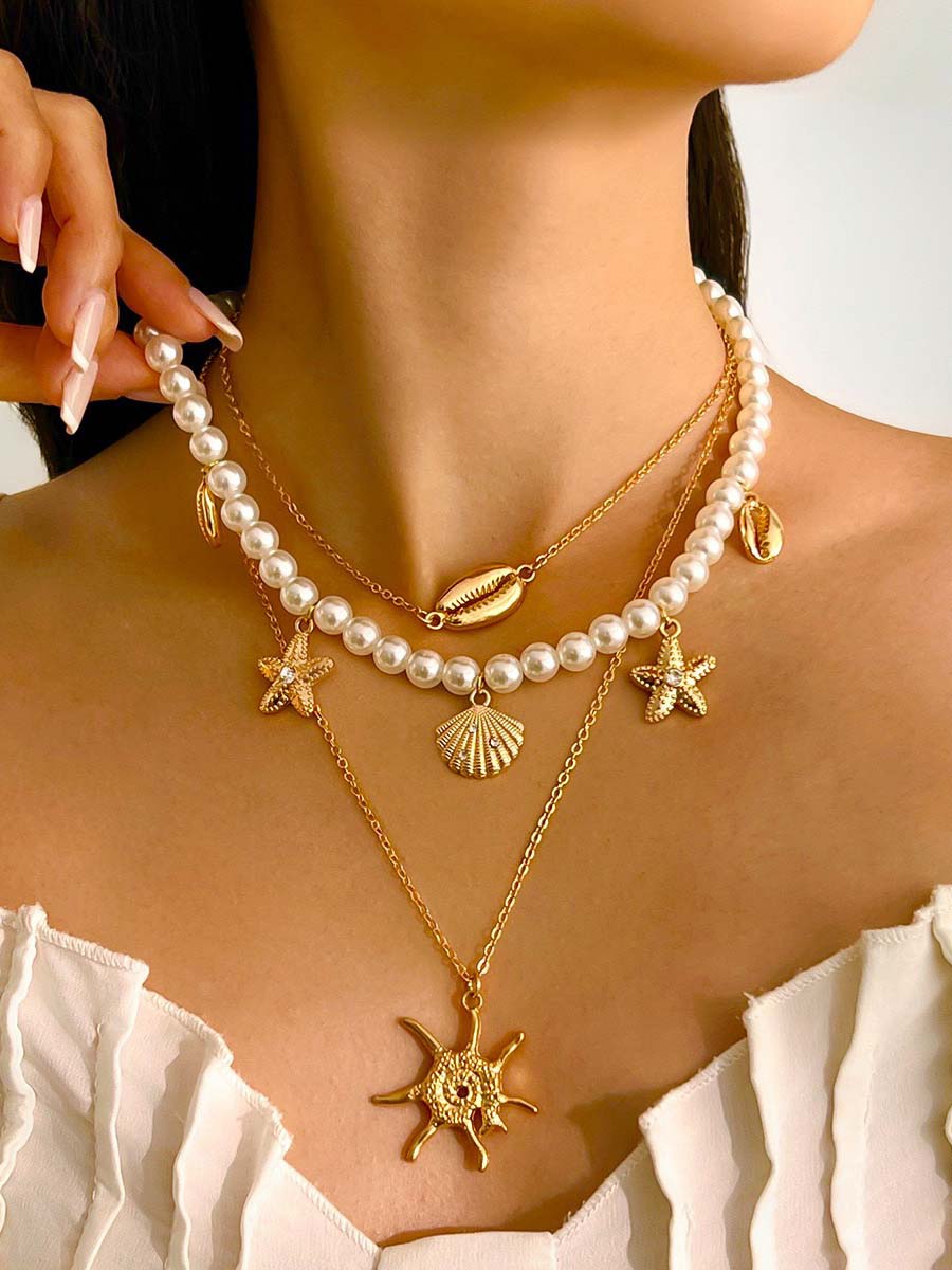 Bella Women's Necklace Set featuring imitation pearls with a vintage nautical design, perfect for adding a touch of elegance to any outfit. 0