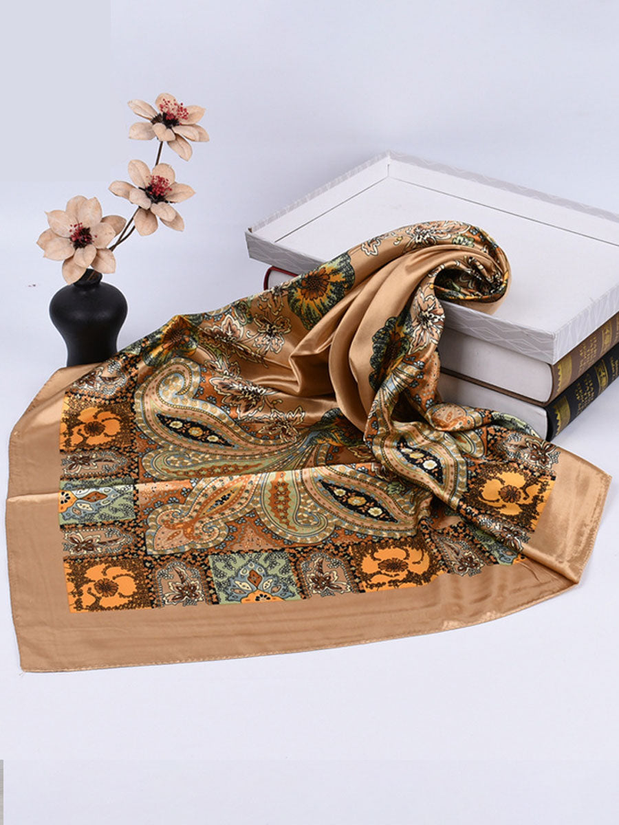 Bella Women's Square Scarf featuring a vibrant paisley print in rich colors, perfect for adding a stylish touch to any outfit. 2
