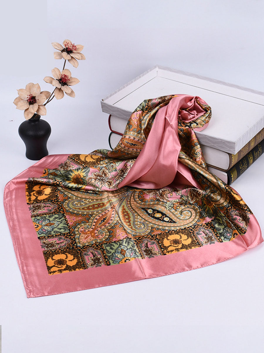 Bella Women's Square Scarf featuring a vibrant paisley print in rich colors, perfect for adding a stylish touch to any outfit. 3
