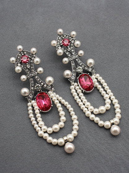 "Rita Women's Earrings featuring a stunning ruby and pearl tassel design, perfect for adding elegance to any outfit." 0