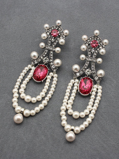 "Rita Women's Earrings featuring a stunning ruby and pearl tassel design, perfect for adding elegance to any outfit." 1
