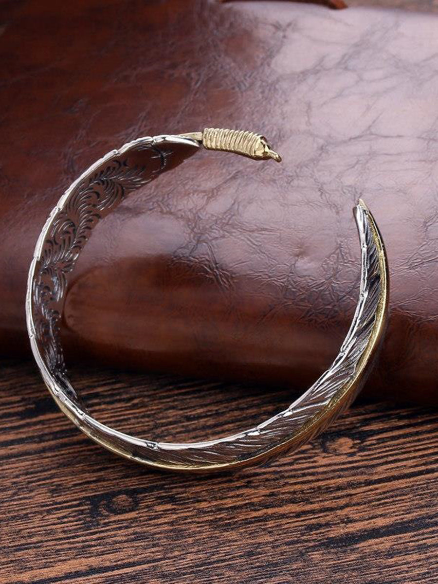 Vera Women's Cuff Bracelet featuring an intricate antique metal feather design, perfect for adding a bohemian touch to any outfit. 2