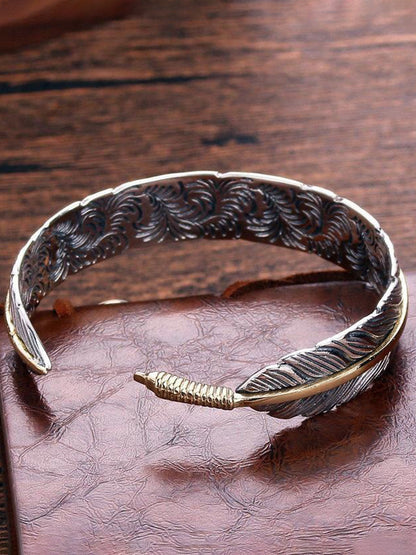 Vera Women's Cuff Bracelet featuring an intricate antique metal feather design, perfect for adding a bohemian touch to any outfit. 3